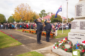 Cobden Police members Craig Jenkins and Ash Pitt salute.