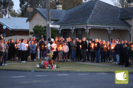 Never forgotten: The crowd gathered in silence before beginning the walk.