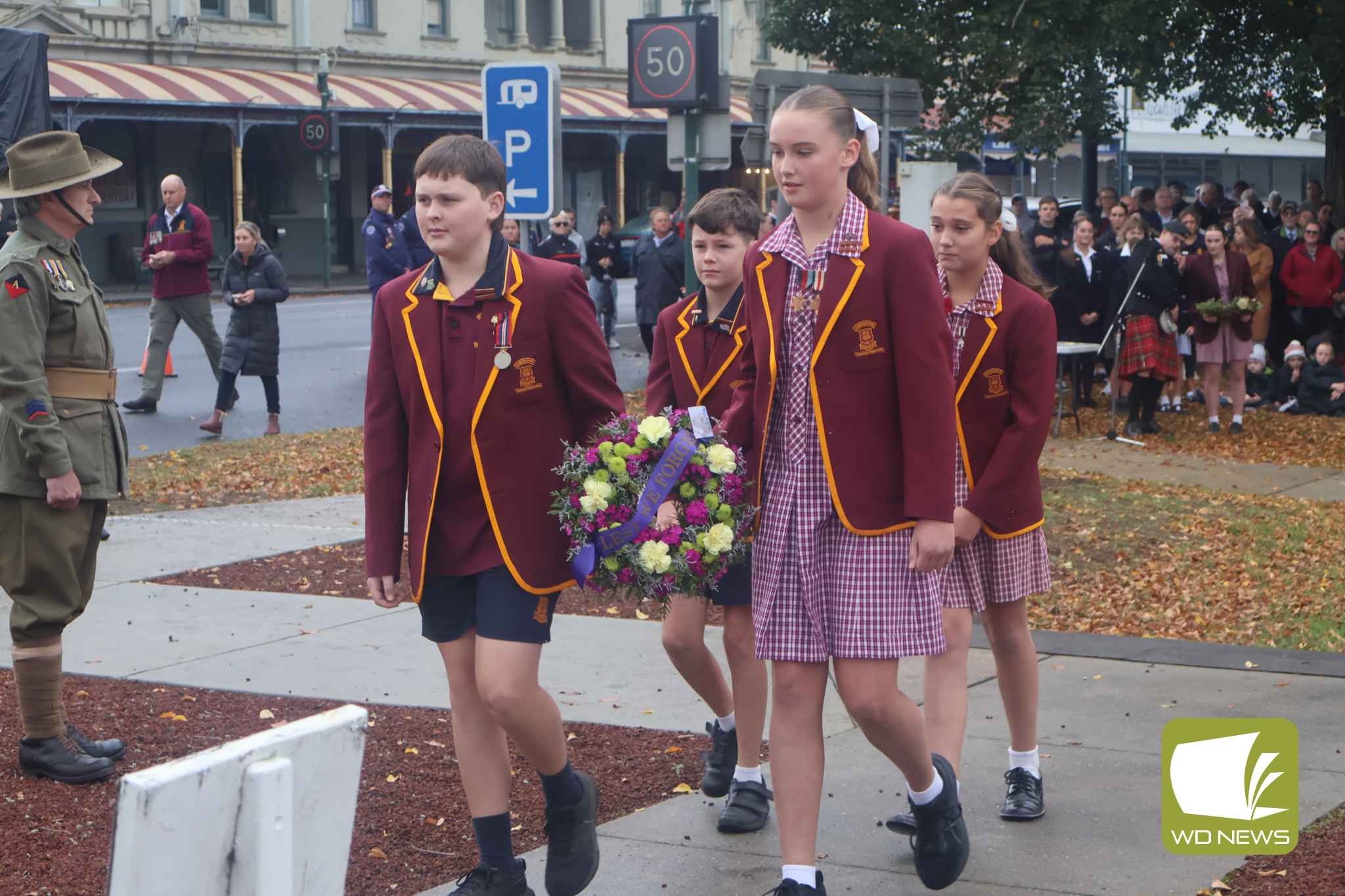 We will remember: Despite wet and chilly conditions, Camperdown’s Anzac Day service saw a large crowd. Student leaders from St Patrick’s Primary School were among those laying wreathes at the foot of the Camperdown Memorial.