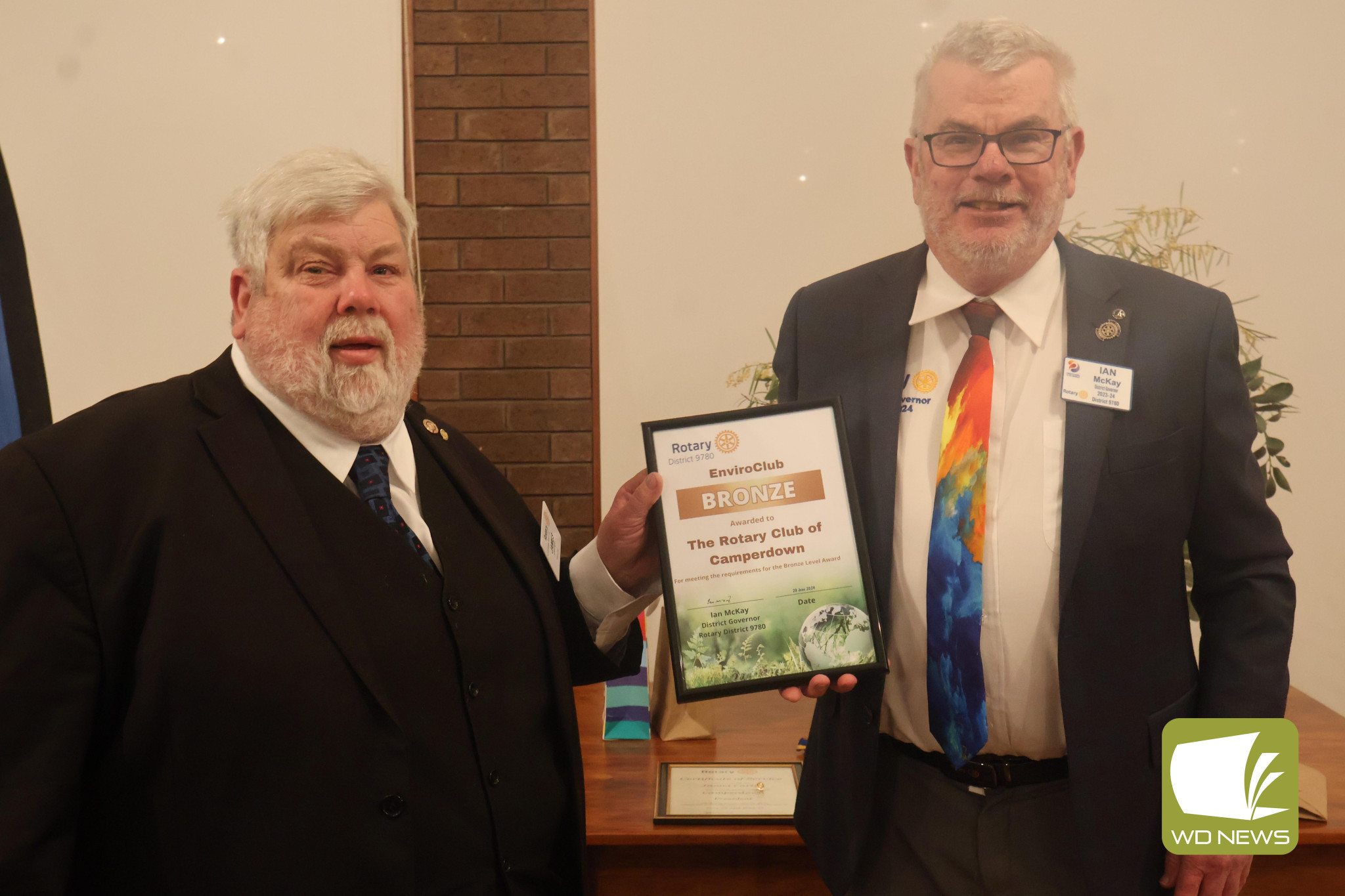 Efforts recognised: Former president James Carter received the EnviroClub Bronze Level Award on behalf of the club from Rotary district governor Ian MacKay.