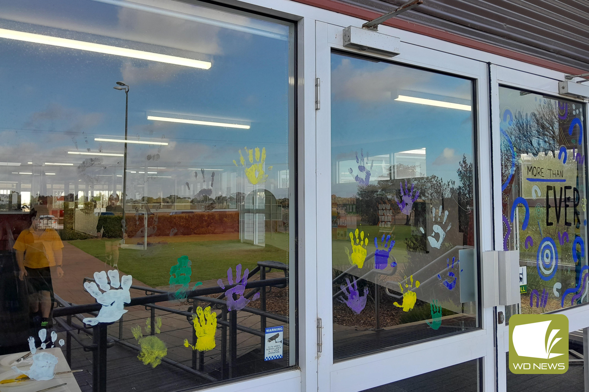 Now more than ever: Derrinallum P-12 College’s front doors were adorned with hand prints and a depiction of this year’s Reconciliation Week theme.