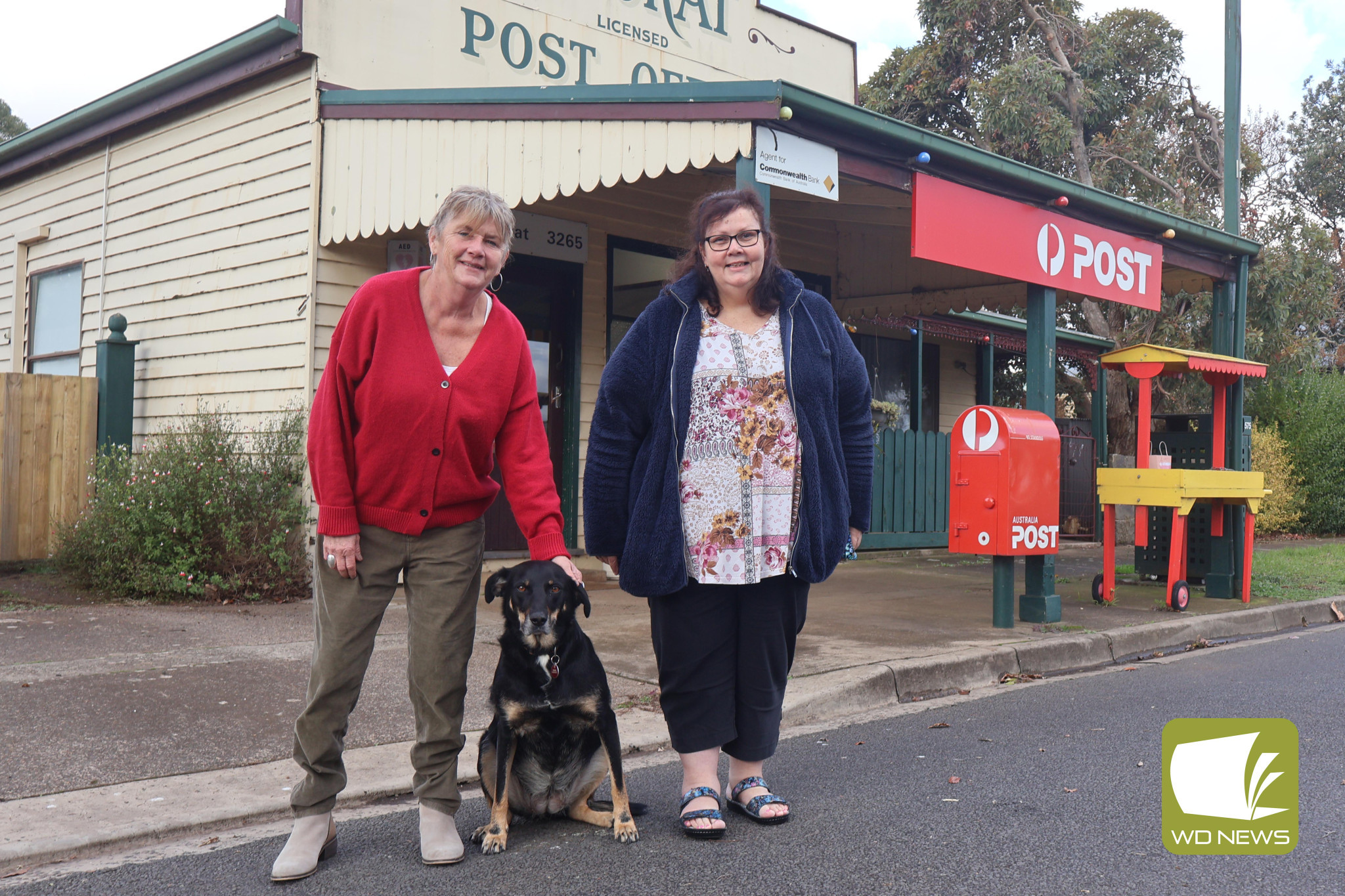 Same site, same service: The Noorat Post Office will usher in a 125-year milestone with current staff Kerry Murphy and Carole Uebergang, in addition to Bobbie Murphy – the shop dog who is such a mainstay that the front counter proudly features scratch marks from her claws.