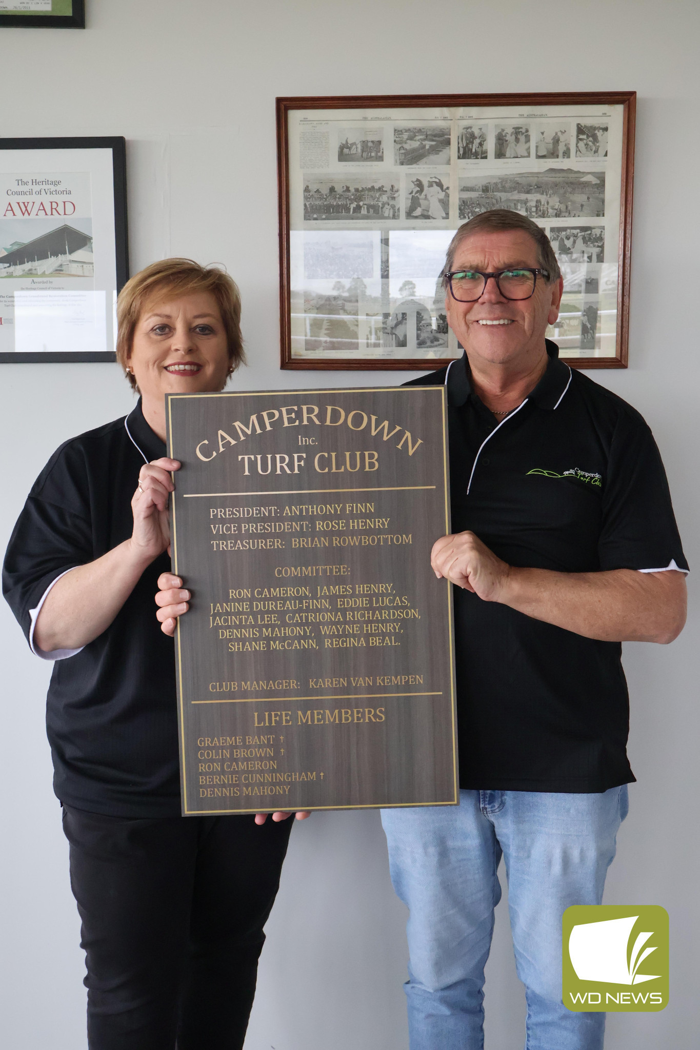 Team effort: Camperdown Turf Club vice president Rose Henry and president Anthony Finn expressed their gratitude to the committee who voted on the donation at the club meeting.