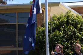 The Australian flag was raised following the service.