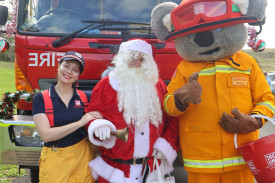 Festive tour: Camperdown CFA’s Sarah Blair, Santa Claus and Captain Koala took a tour around Camperdown in a decorated fire engine on Sunday, delivering lollies and small surprises at every stop.
