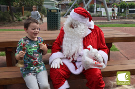Best gate-crasher: Birthday boy Kaimana Karaitiana was thrilled when Santa Claus and Captain Koala visited Apex Park during his birthday party.