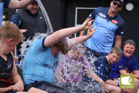 Brrrr: Cobden Primary School students and staff did not shy away from taking part in an ice bucket challenge to celebrate a visit from famed fundraisers Daniher’s Drive last Friday.