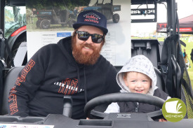 Test ride: Andrew and Logan Bradshaw got up close with a quad bike display, taking the driver’s seat and seeing other farm machinery up close at the Camperdown Show.