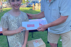 Progressing Cobden’s Milton Parlour presents Lillian Angus with $500 in vouchers for winning the Monster Shopper Draw.