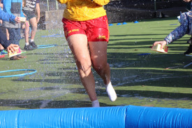 Students lined up to splash their teachers during their run to the pool.