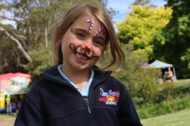 Jemma Cameron got into the Christmas spirit and enjoyed getting her face painted at the Timboon Community Christmas last Friday.