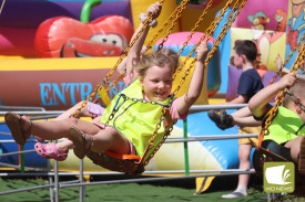 Spinning around: Younger Noorat Show attendees jumped at the chance to swing around on rides.