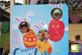 Noah Pegg (10, from left), Chelsea James (6), Cassandra Smith (6) and Finn James (8) squeezed into an Easter display.