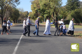 Bright sunshine greeted the crowd as they made their way along the Stations of the Cross.