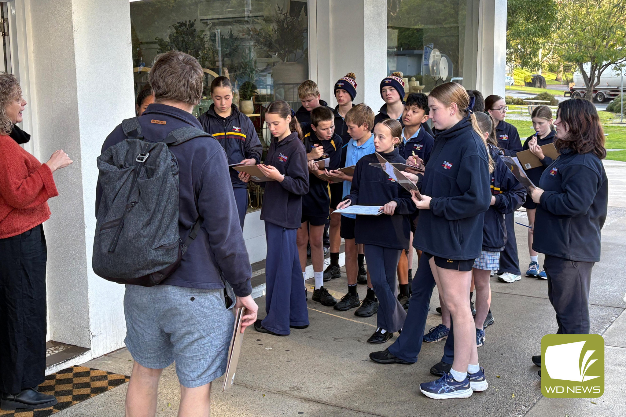 Focused: Milk and Honey business owner Simone Togni welcomed Timboon P-12 Year 7 students to her store as part of their economics class.