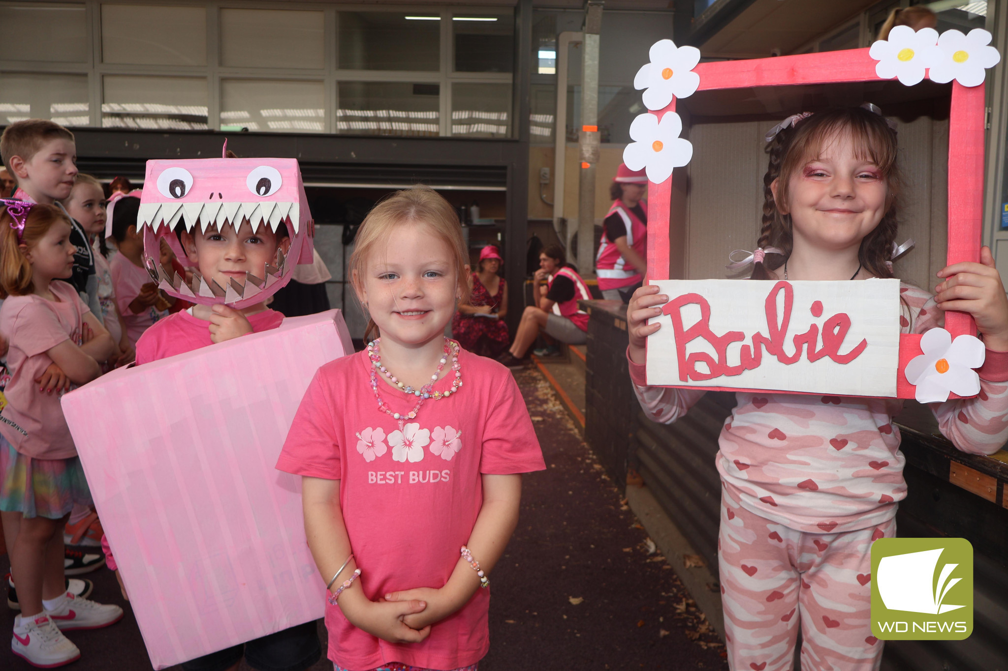 Celebration: Students gathered for a whole school assembly to begin their fundraiser on Wednesday, which included a parade of students showing off their dress up designs.