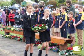 Boys from Cobden Primary carried their wreath closely together.