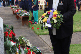 Joan Scott laying a wreath on behalf of the local Bendigo Bank.