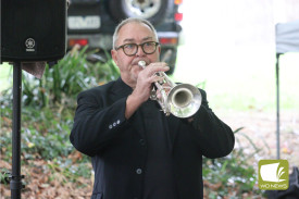Dennis Hancock performed the last post, followed by a minute of silence.