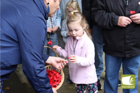 Timboon Action president Enid O’Connor assisted with handing out poppies to all who wished to lay one at the memorial, including the towns’ youngest.