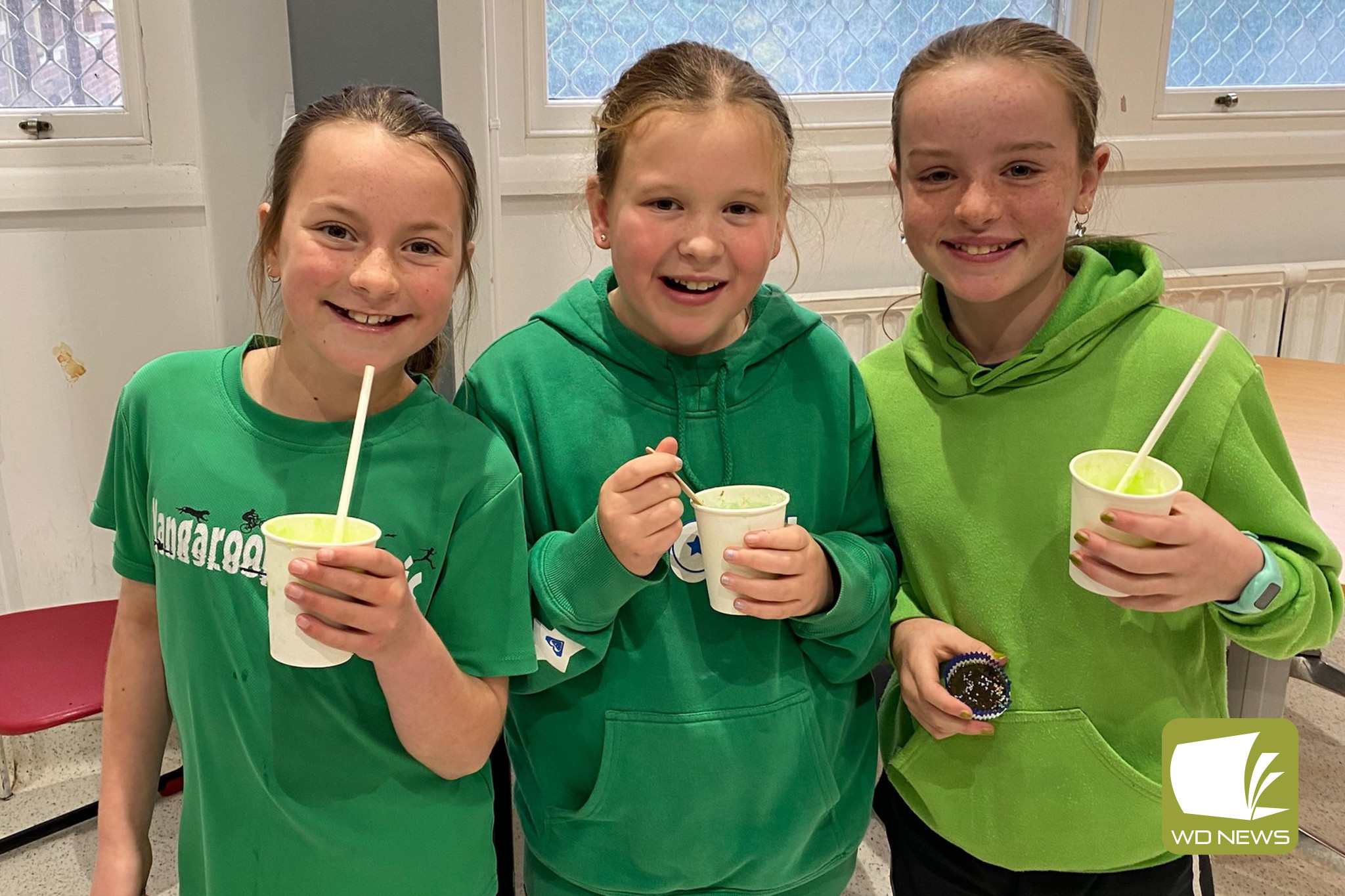 Bake sale success: Olive Doolan (from left), Lucille Riedl and Thea Whitehead enjoyed delicious treats while supporting Need for Feed at Timboon P-12.
