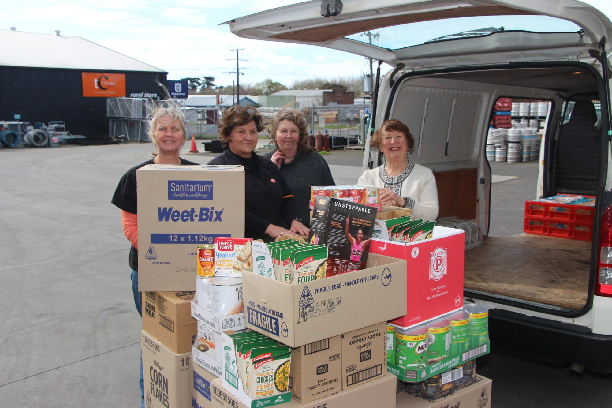 A helping hand: Anglicare community development coordinator Louise Serra, Terang IGA sales assistant Julie Lourey, Terang Community Co-op project manager Andrea Balcombe and Terang’s Julie Pomeroy loaded up $2000 in food items to help those in need.