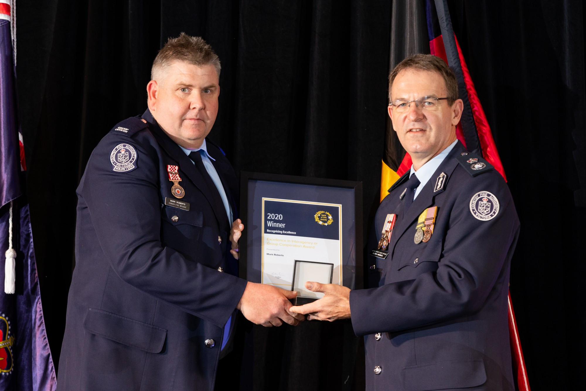 Congratulations: Cobden CFA’s Mark Roberts, pictured with CFA Acting Deputy Chief Officer Glenn Pröbstl, received an award for his efforts during the St Pat’s Day fires. Photo courtesy of Blair Dellemijn of Uniform Photography.