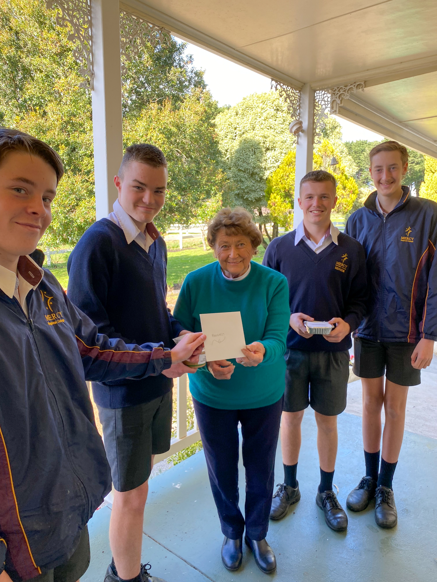 Home delivery: MRC VCAL students delivered hot meals to parishioners of the St Pats Church including Margaret Murrihy.