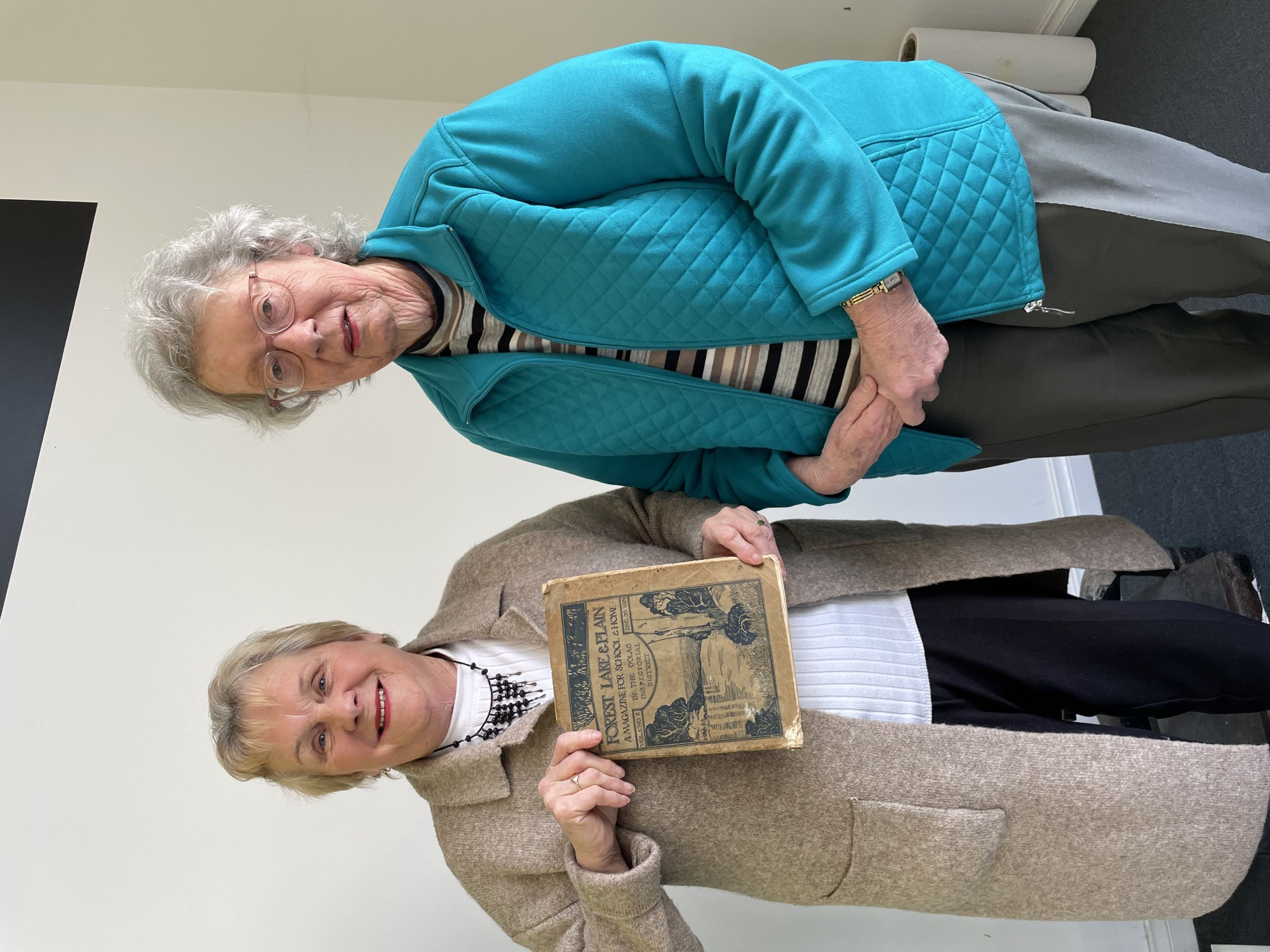 Important to protect: Delia Robertson donated a 100 year old school book to the Cobden Historical Society Inc, pictured with society member Jennifer Kripp (right).