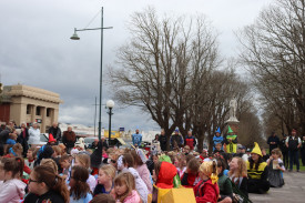 Community members gathered for the parade beneath the clocktower on Monday. 