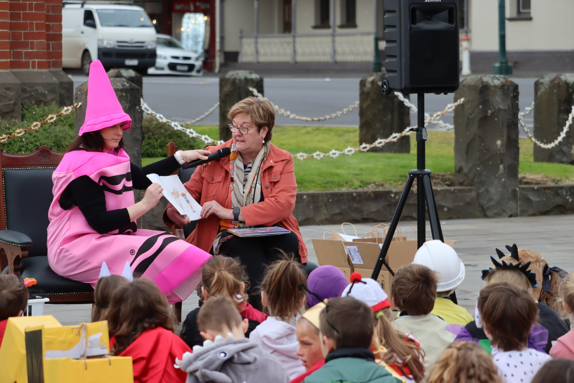 Reading: Corangamite Shire mayor Ruth Gstrein reads to Camperdown College students during Book Week celebrations.