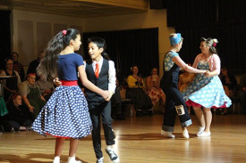 Couples show their moves in the dance competition. 