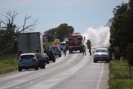 Smoke billowed from a burning vehicle on the Princes Highway at Weerite yesterday.