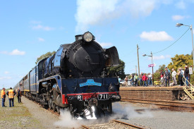 The arrival of an R-Class steam engine and nine heritage carriages drew about 100 onlookers to the Camperdown rail station, while others viewed the train at crossings along the line.