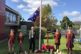 St Pat’s principal Michael McKenzie with school captains held a modified school Anzac Day ceremony. 