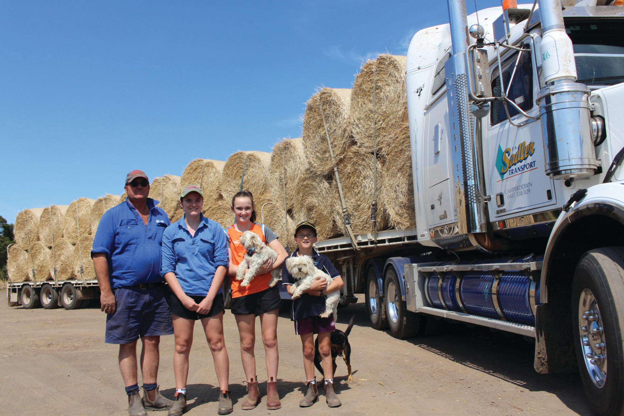 Camperdown transport operator Trevor Sadler is set to deliver two semi loads of hay to help a mate out in the Bega Valley. He is pictured with his children Ella, Nellie and George.