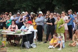 Judges assess the Fashions on the Field competitors.