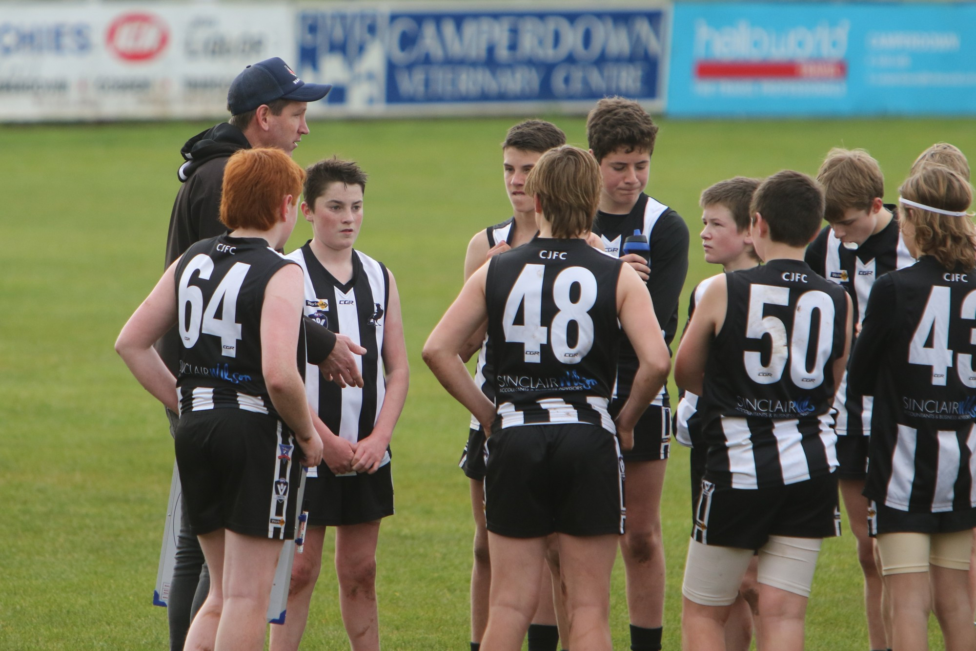 Camperdown coach Stephen Sinnott addresses the Magpies’ under 14 football team during their round one clash against South Warrnambool last Saturday.