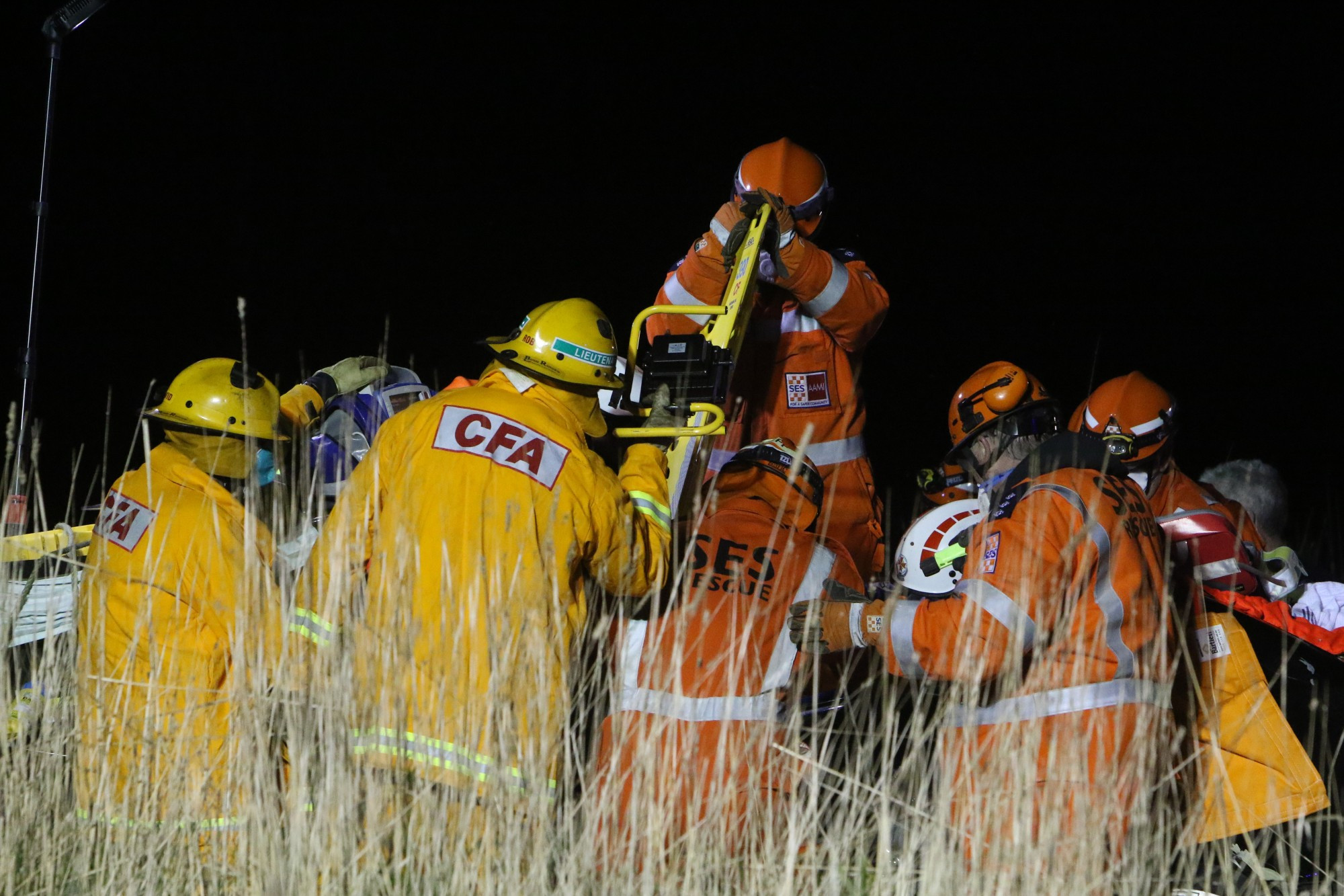 Teamwork: Emergency services work together to remove a patient from a vehicle involved in a collision on Friday.