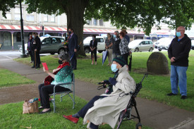 A small number of residents gathered to pay their respects. 