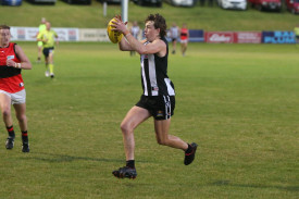 Role player: Recruit Brayden Draffin latches onto a loose ball in the second term. 
