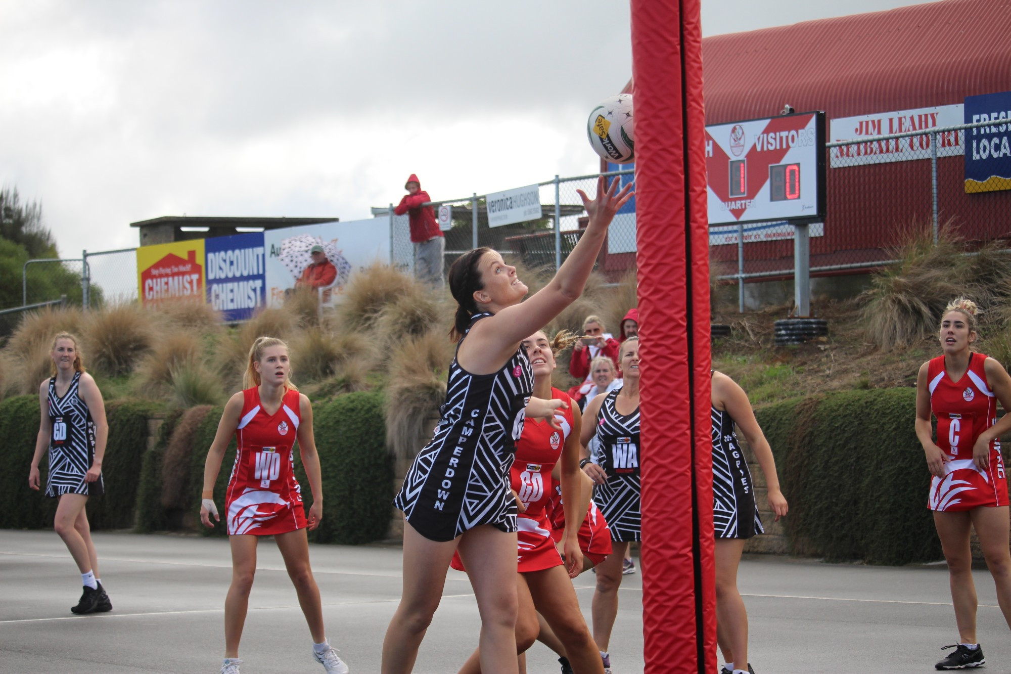 Helping hand: Camperdown goal shooter Amanda Gilbert uses the goal post to reel in the ball during her side’s 40 goal draw with South Warrnambool last Saturday.