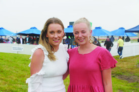 Mikayla and Libby from Terang and Port Fairy said they were enjoying the races despite the wet weather. 