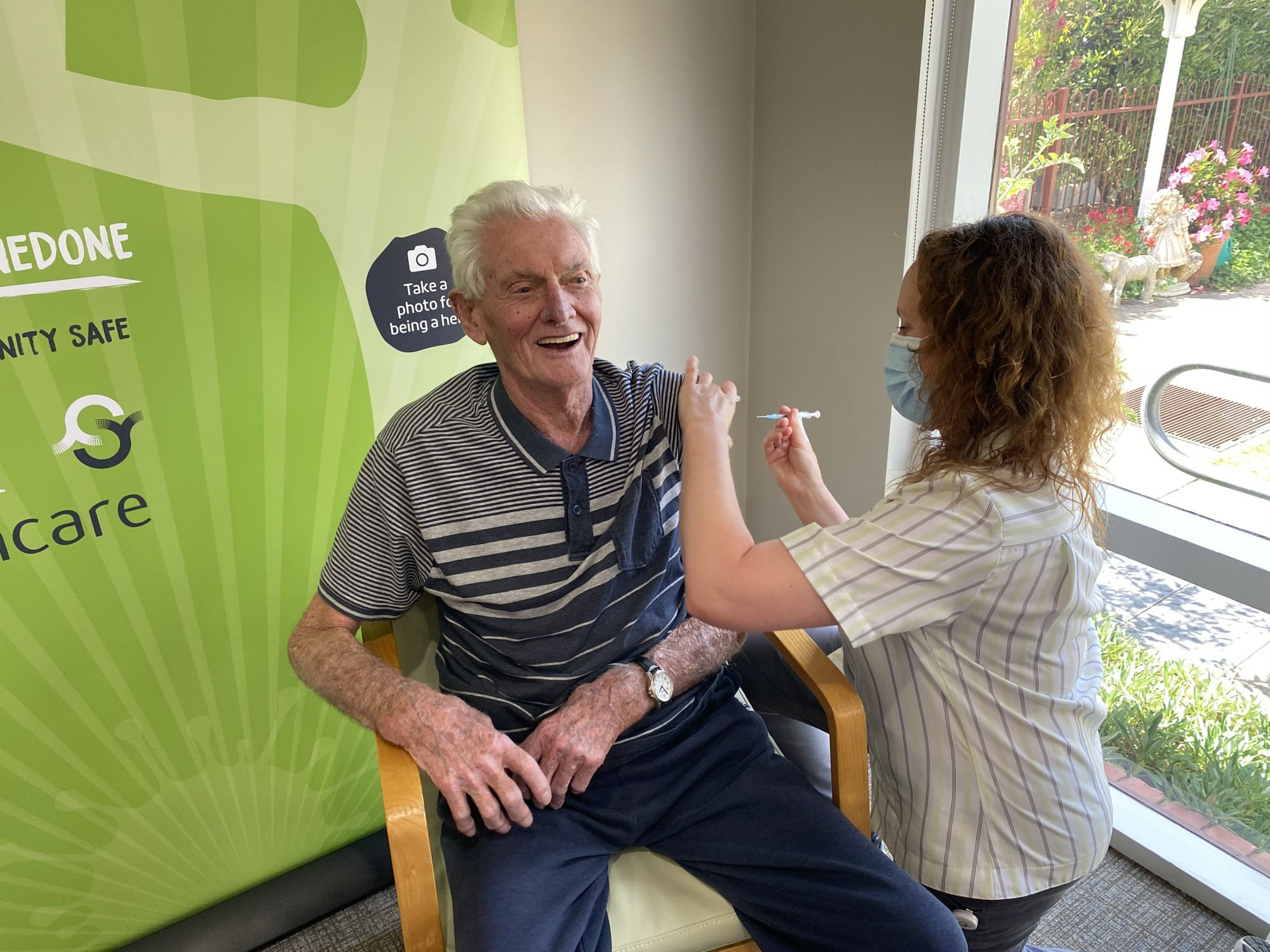 Step one: Ray Riches, with nurse Tash Swayne, gives the thumbs up after receiving the first dose of his COVID vaccination on Friday.