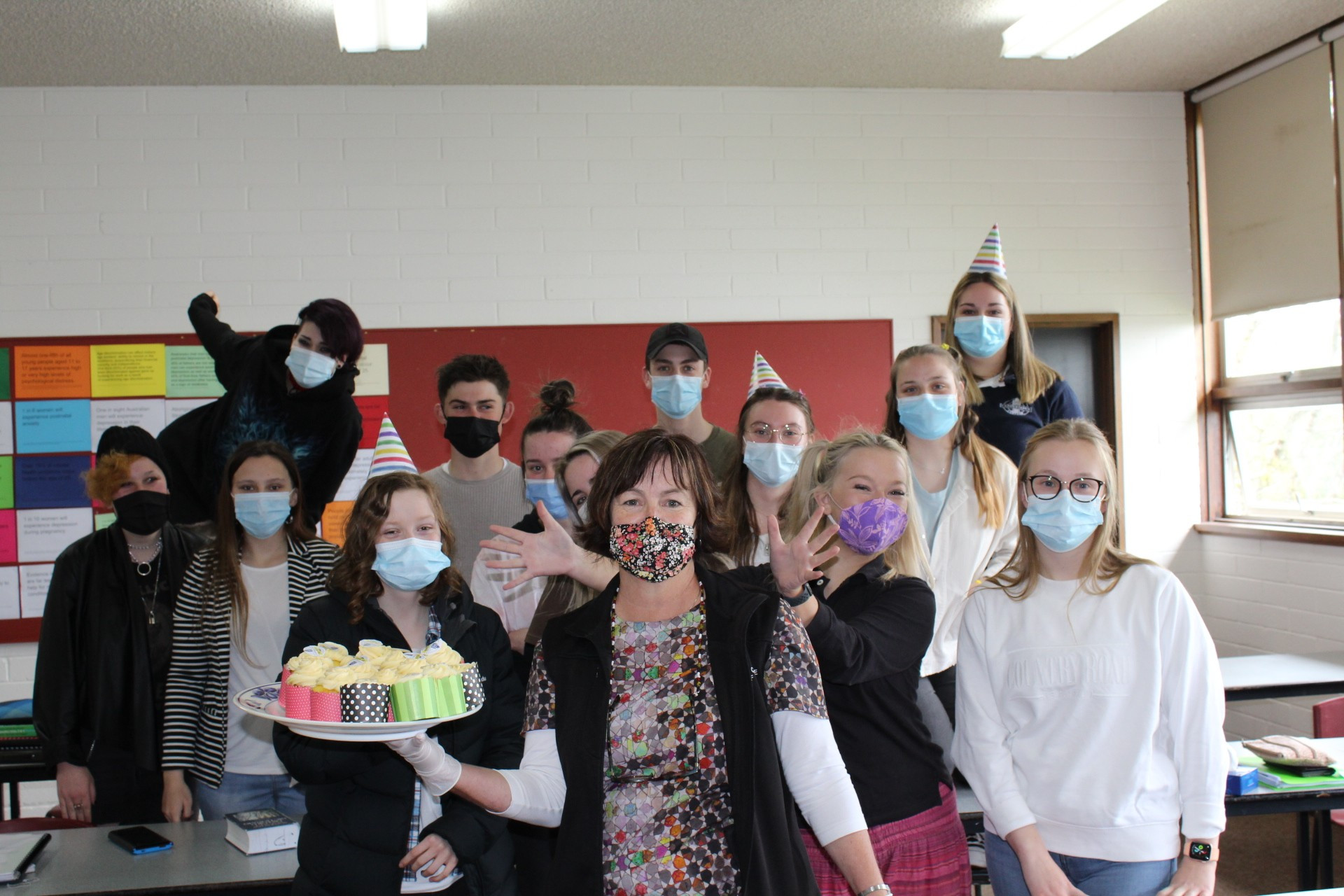 Happy birthday: Camperdown College principal Cherie Kilpatrick with Year 12 students celebrate the school’s 100th birthday.