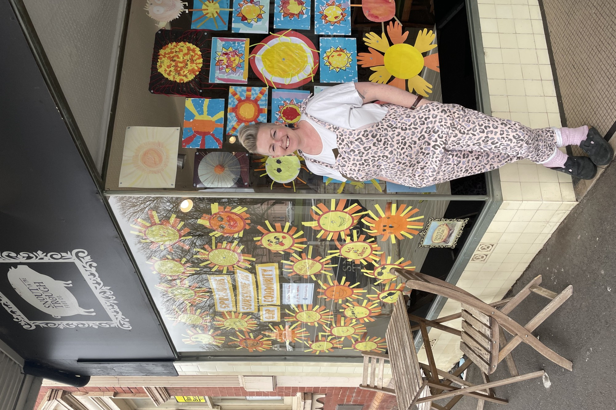 Taking care: Camperdown College junior students have used artwork to hopefully boost the spirits of locals, with a display in the window of Snout in the Trough Food Co.