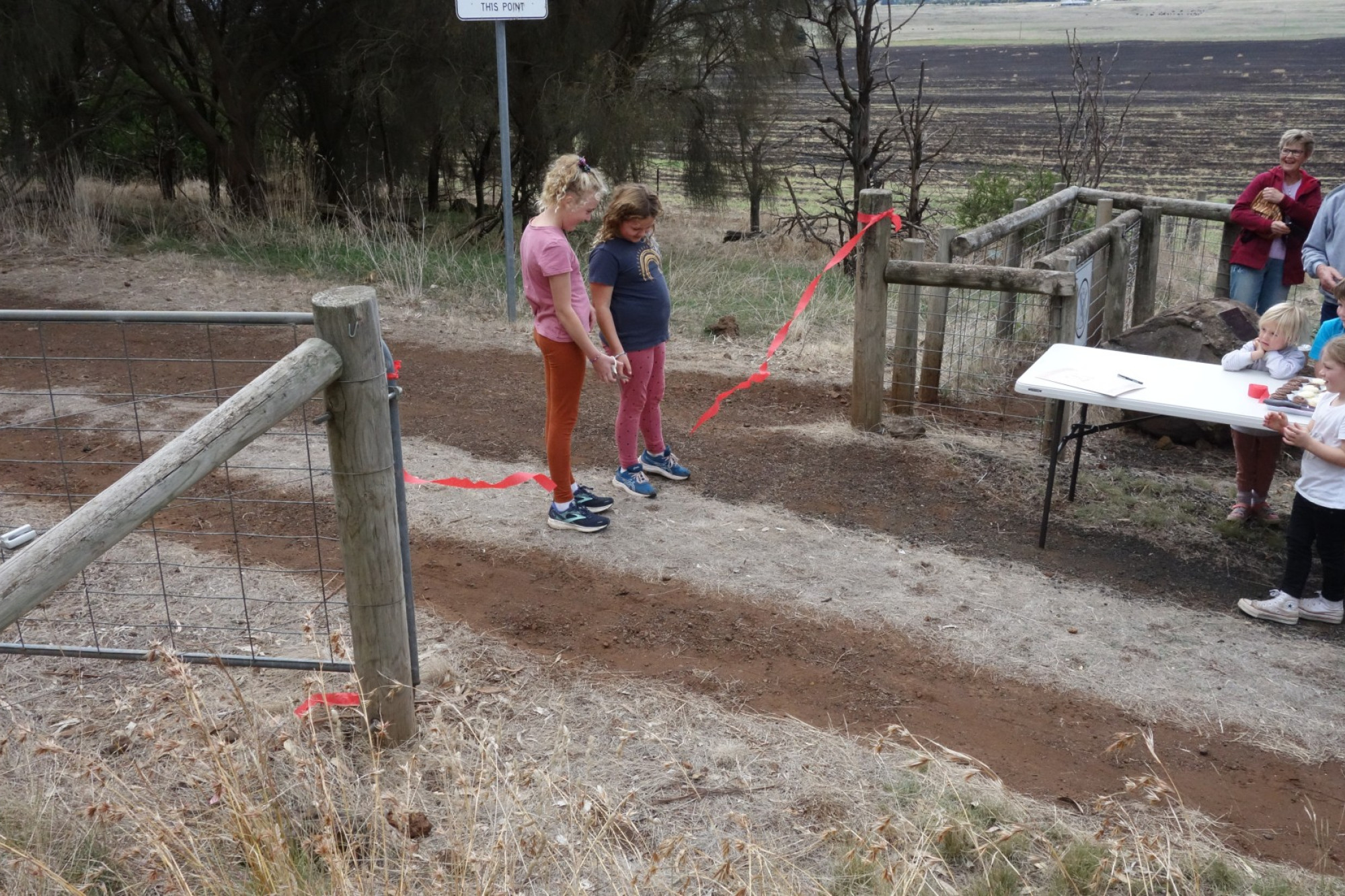 Project complete: Charlotte and Lexie Henderson cut the ribbon to officially open the base track at Mount Elephant over the weekend.