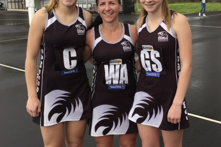 After having the HFNL division one Best and Fairest medal named after her, Tracey Baker (centre) said the biggest highlight of her 33-year career was playing with her daughters Chelsea (left) and Krystal (right).