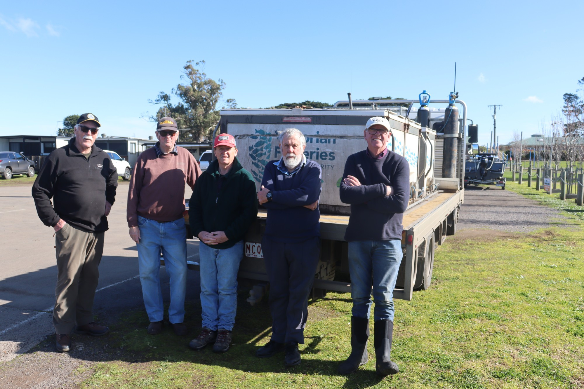 Top-up: Members of the Lake Purrumbete Angling Club helped release 10,000 brown trout at the popular fishing spot last week.