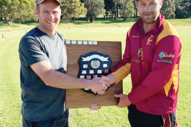 Brad Hillman presents the shield named after his late father Graham to Pomborneit captain Grant Place.